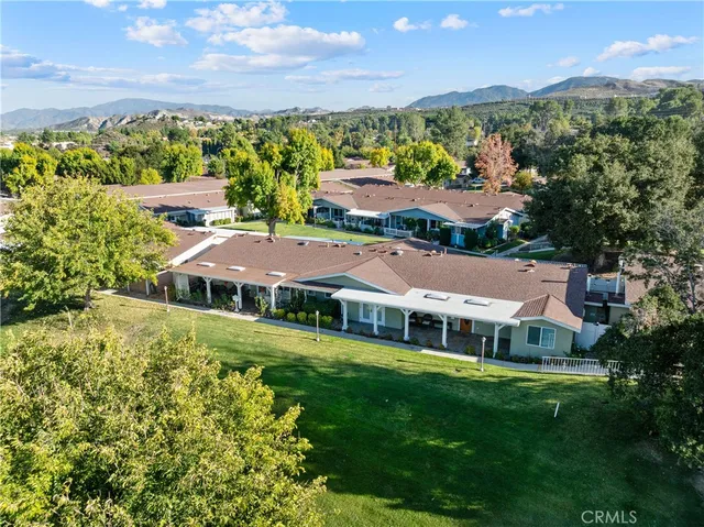 an aerial view of a house with a garden
