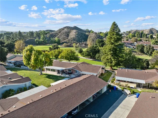 an aerial view of a house with a ocean view