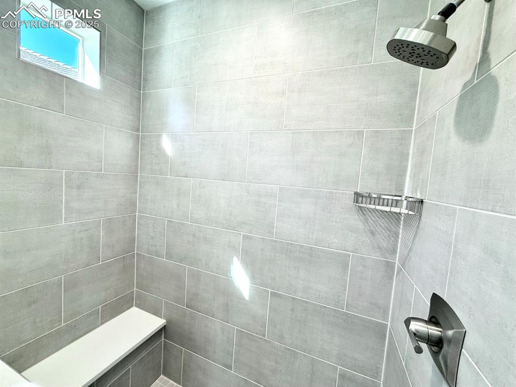 3135 Promise Point Colorado Springs, CO 80921 - Photo 25 of 33 Bathroom featuring tiled shower