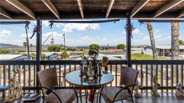 a view of a balcony dining area