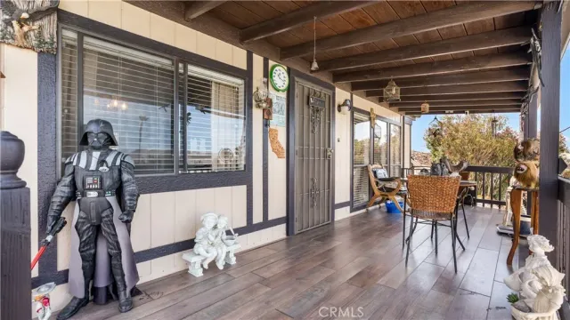 a dining room with furniture window and wooden floor