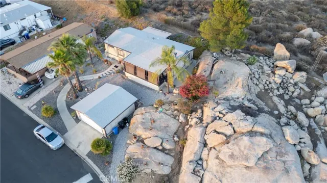 an aerial view of a house with a yard and garden
