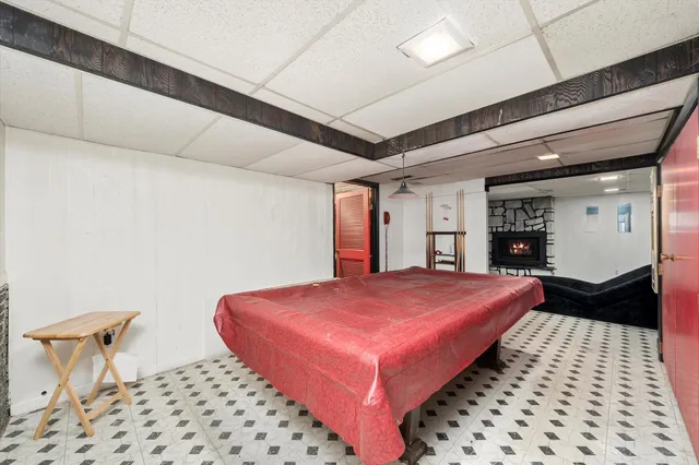 a bedroom with a bed and a table with closet