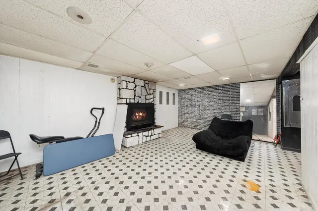 a room with furniture a flat screen tv and a rug