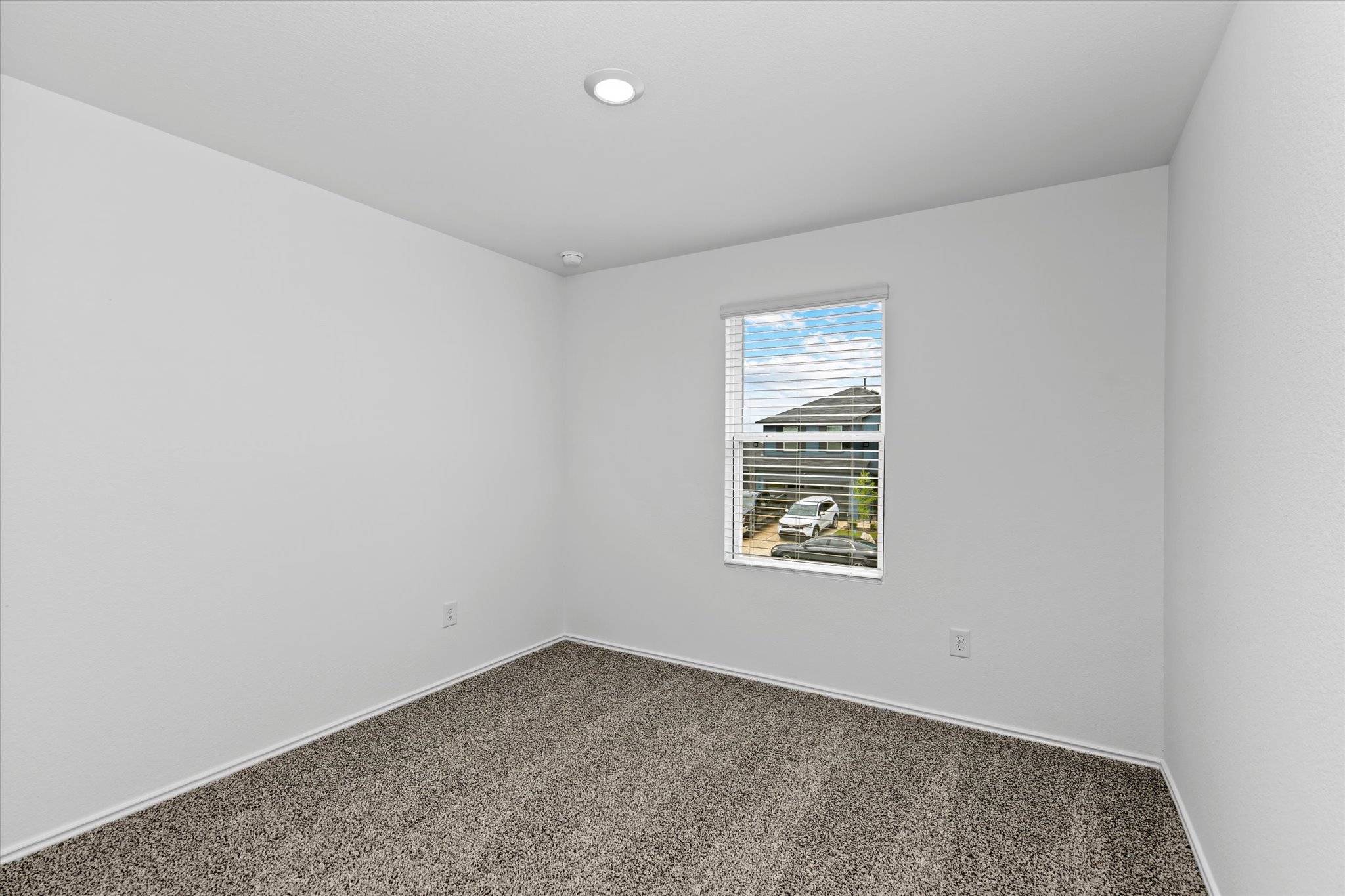 456 Sandringham Loop Kyle, TX 78640 - Photo 12 of 40 Recessed lighting illuminates this versatile room, offering a neutral canvas for your personal touches.