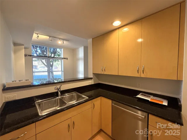 a bathroom with a shower and a sink