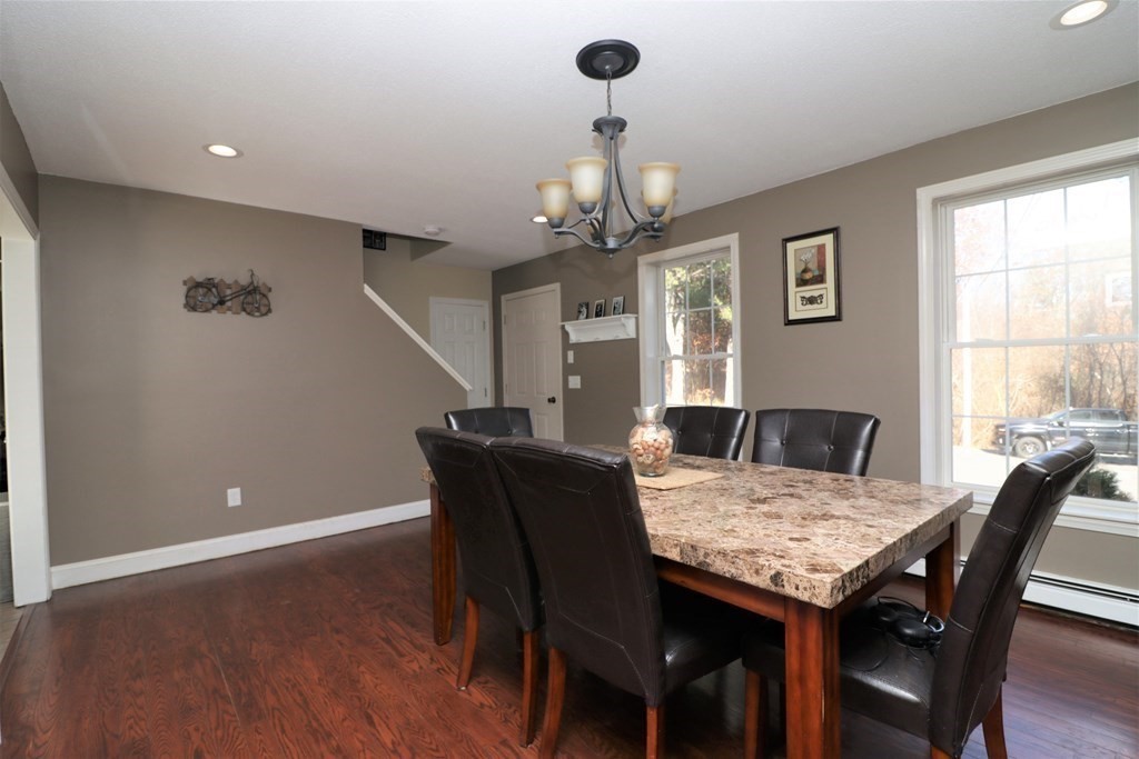 389 County Road Ashby, MA 01431 - Photo 12 of 34 a view of a dining room with furniture window and wooden floor