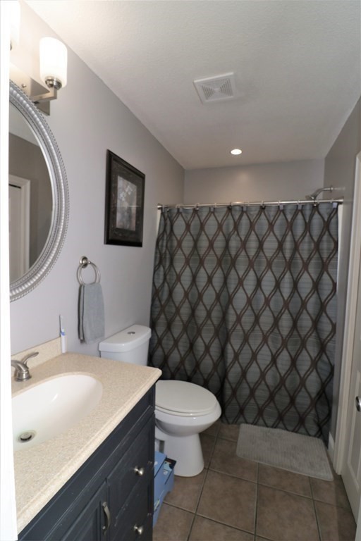 389 County Road Ashby, MA 01431 - Photo 17 of 34 a bathroom with a sink a toilet and a mirror