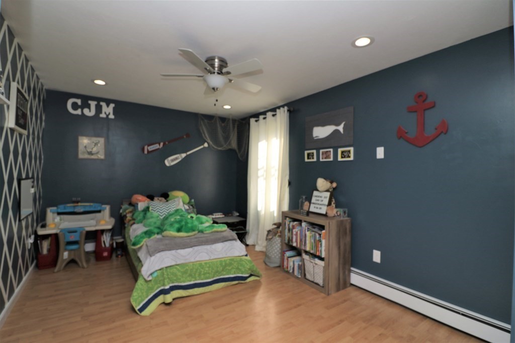 389 County Road Ashby, MA 01431 - Photo 24 of 34 a bedroom with furniture and a fan