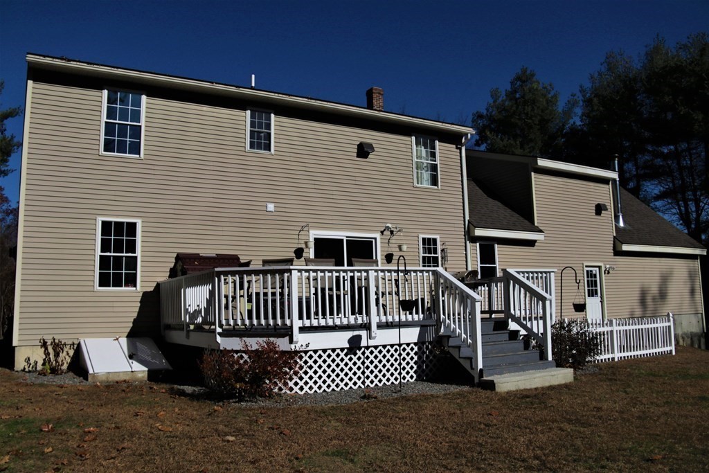 389 County Road Ashby, MA 01431 - Photo 30 of 34 a view of a house with wooden deck front of house