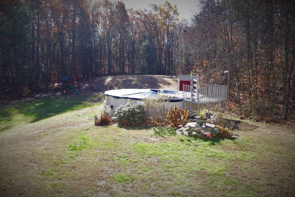 389 County Road Ashby, MA 01431 - Photo 34 of 34 a view of a backyard with plants and trees