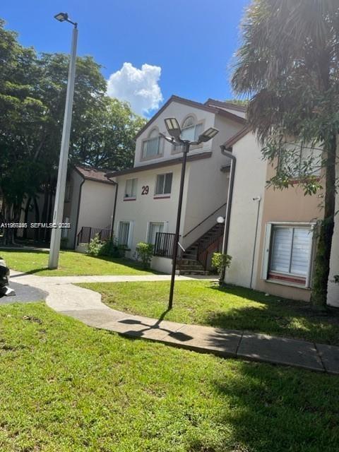 14020 Southwest 90th Terrace, Unit 14020 Miami, FL 33186 - Photo 12 of 13 a house with swimming pool