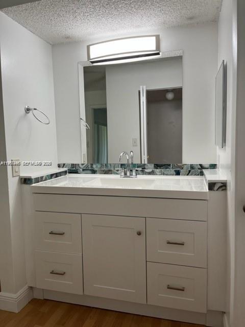 14020 Southwest 90th Terrace, Unit 14020 Miami, FL 33186 - Photo 5 of 13 a bathroom with a sink and a mirror