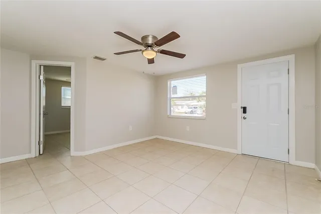 a view of an empty room with a window