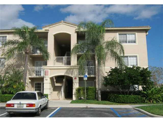 5045 Wiles Road, Unit 104 Pompano Beach, FL 33073 - Photo 3 of 10 Exterior Front