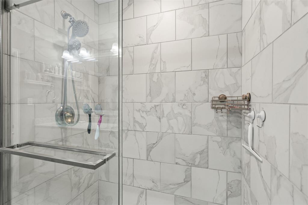 905 Poe Street Azle, TX 76020 - Photo 20 of 30 a bathroom with a shower