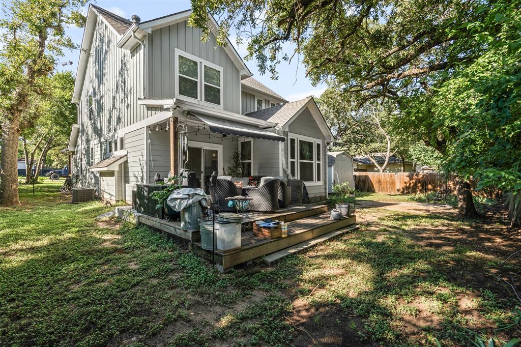 905 Poe Street Azle, TX 76020 - Photo 26 of 30 a view of a house with backyard porch and sitting area