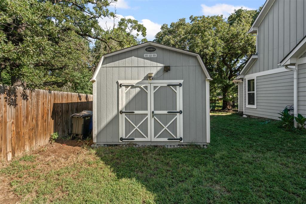 905 Poe Street Azle, TX 76020 - Photo 29 of 30 a view of a small house with a small garden