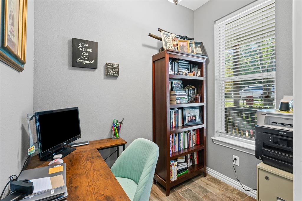 905 Poe Street Azle, TX 76020 - Photo 9 of 30 a workspace with furniture and a window