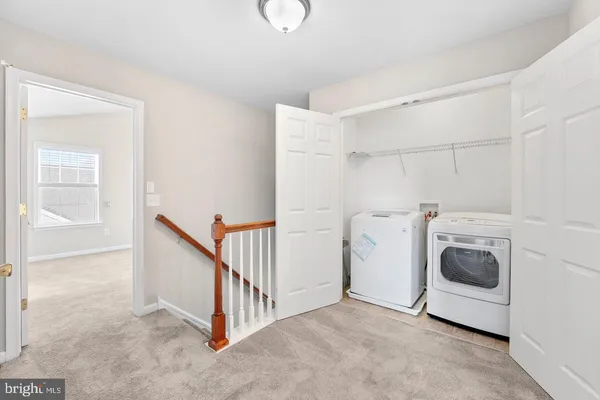 a view of a storage & utility room with washer and dryer
