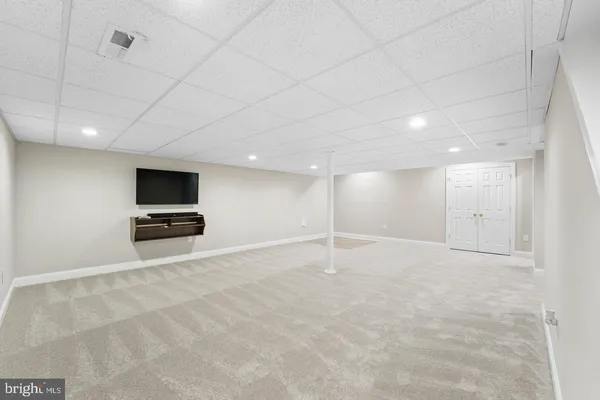 a view of an empty room with a sink
