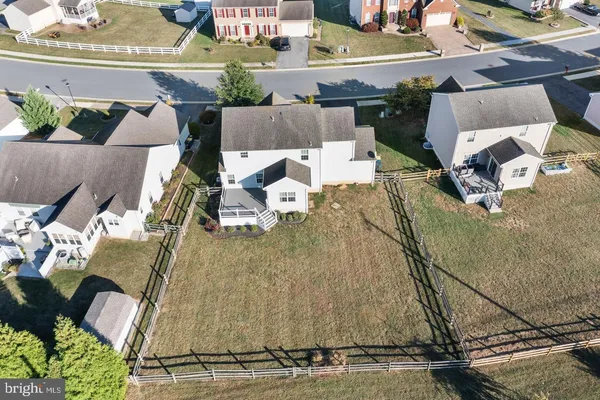 an aerial view of a house with outdoor space