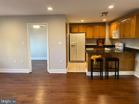 1200 South Arlington Ridge Road, Unit 411 Arlington, VA 22202 - Photo 1 of 9 a kitchen with stainless steel appliances granite countertop a refrigerator a stove and a microwave