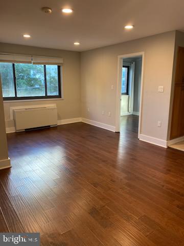 1200 South Arlington Ridge Road, Unit 411 Arlington, VA 22202 - Photo 5 of 9 an empty room with wooden floor and windows
