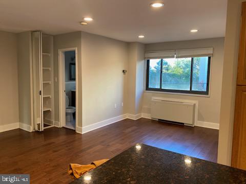 1200 South Arlington Ridge Road, Unit 411 Arlington, VA 22202 - Photo 6 of 9 an empty room with wooden floor and windows