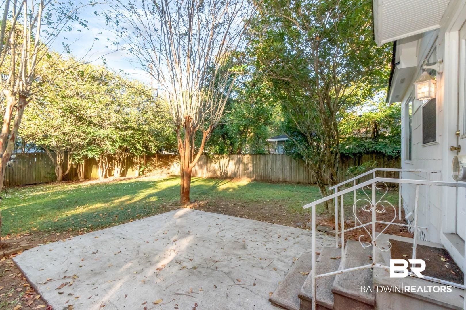 16 Princess Anne Road Mobile, AL 36608 - Photo 28 of 40 Fenced backyard with a patio area