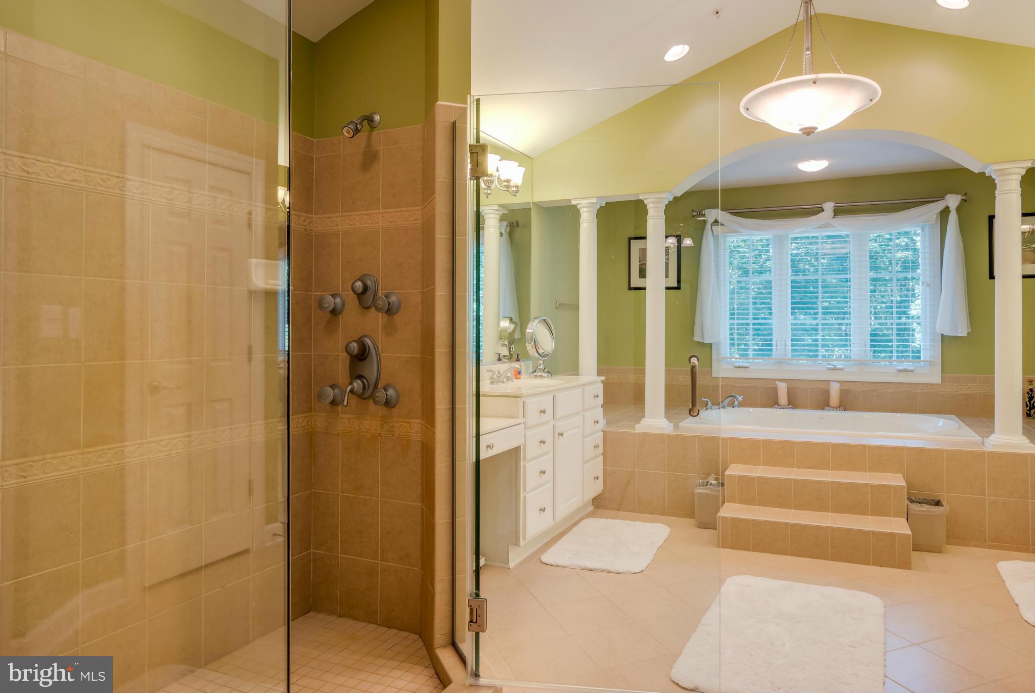 9755 Hawkins Creamery Road Laytonsville, MD 20882 - Photo 22 of 30 a bathroom with a tub shower and sink