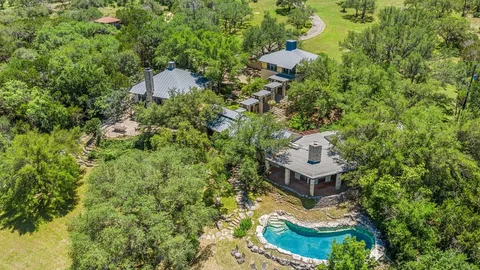an aerial view of a house with a garden