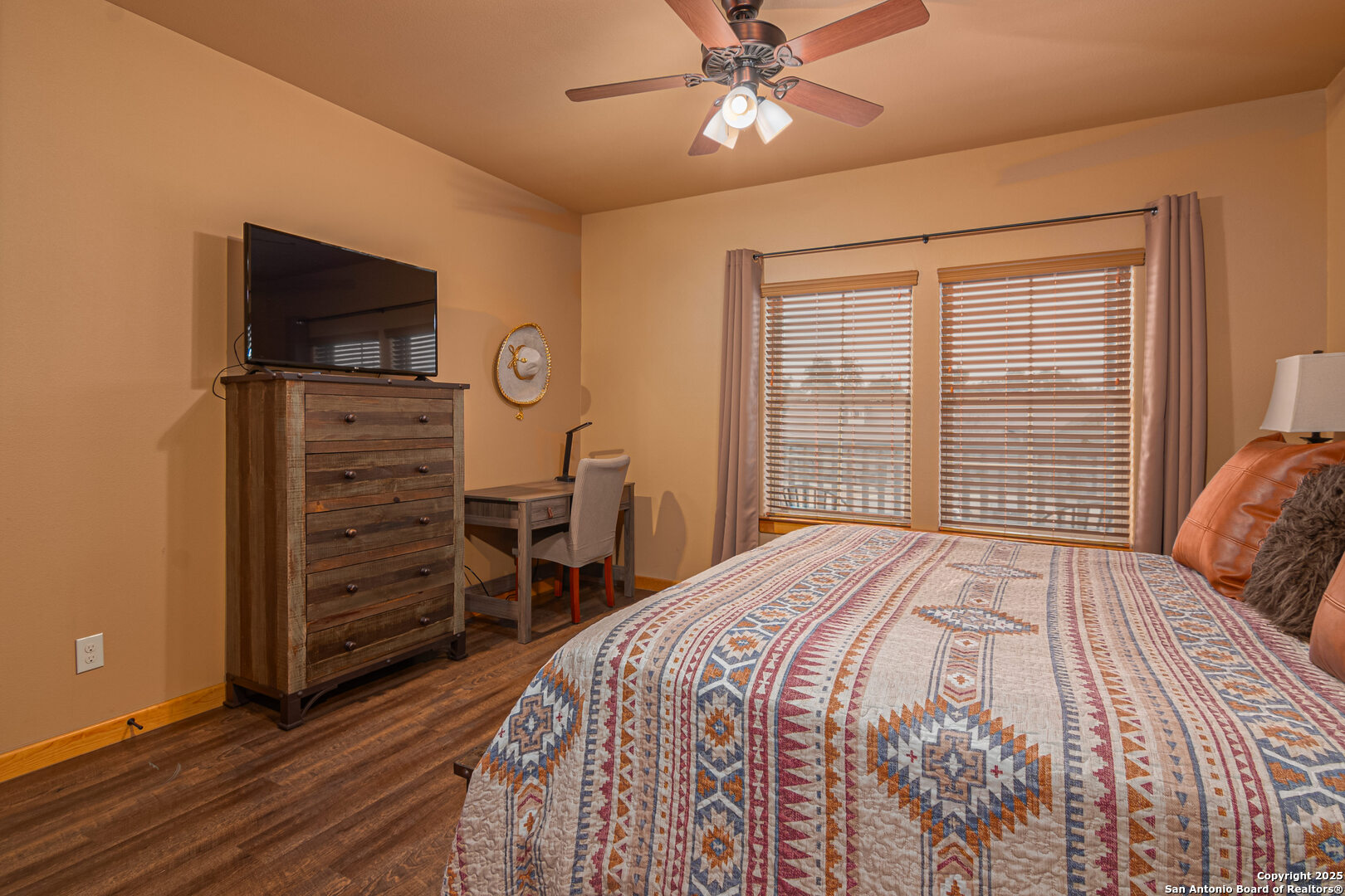 1554 Gruene Road, Unit A5 New Braunfels, TX 78130 - Photo 12 of 22 a bedroom with a bed and a flat screen tv