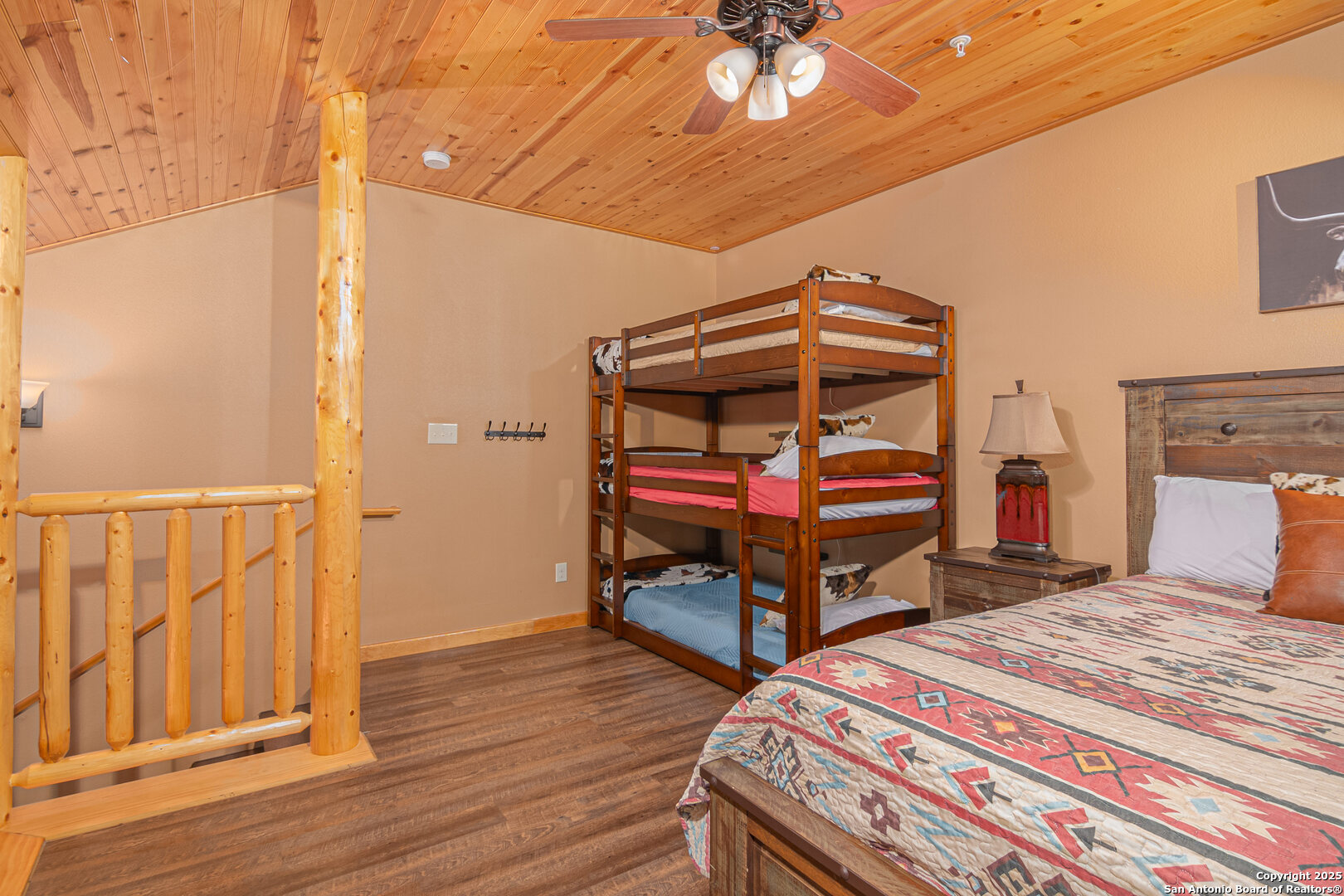 1554 Gruene Road, Unit A5 New Braunfels, TX 78130 - Photo 14 of 22 a bedroom with a bed and wooden floor