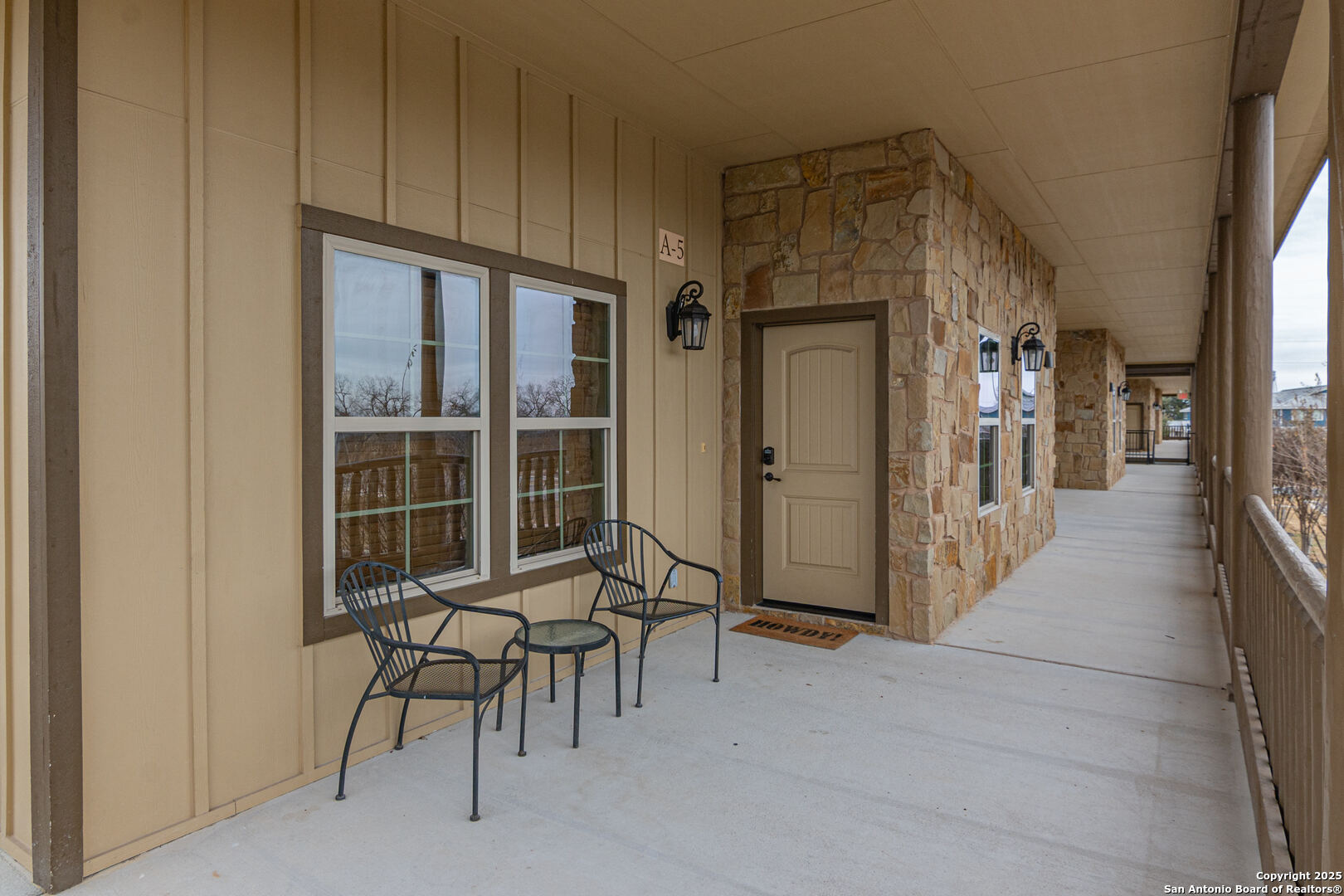 1554 Gruene Road, Unit A5 New Braunfels, TX 78130 - Photo 16 of 22 a view of a hallway with wooden furniture and windows