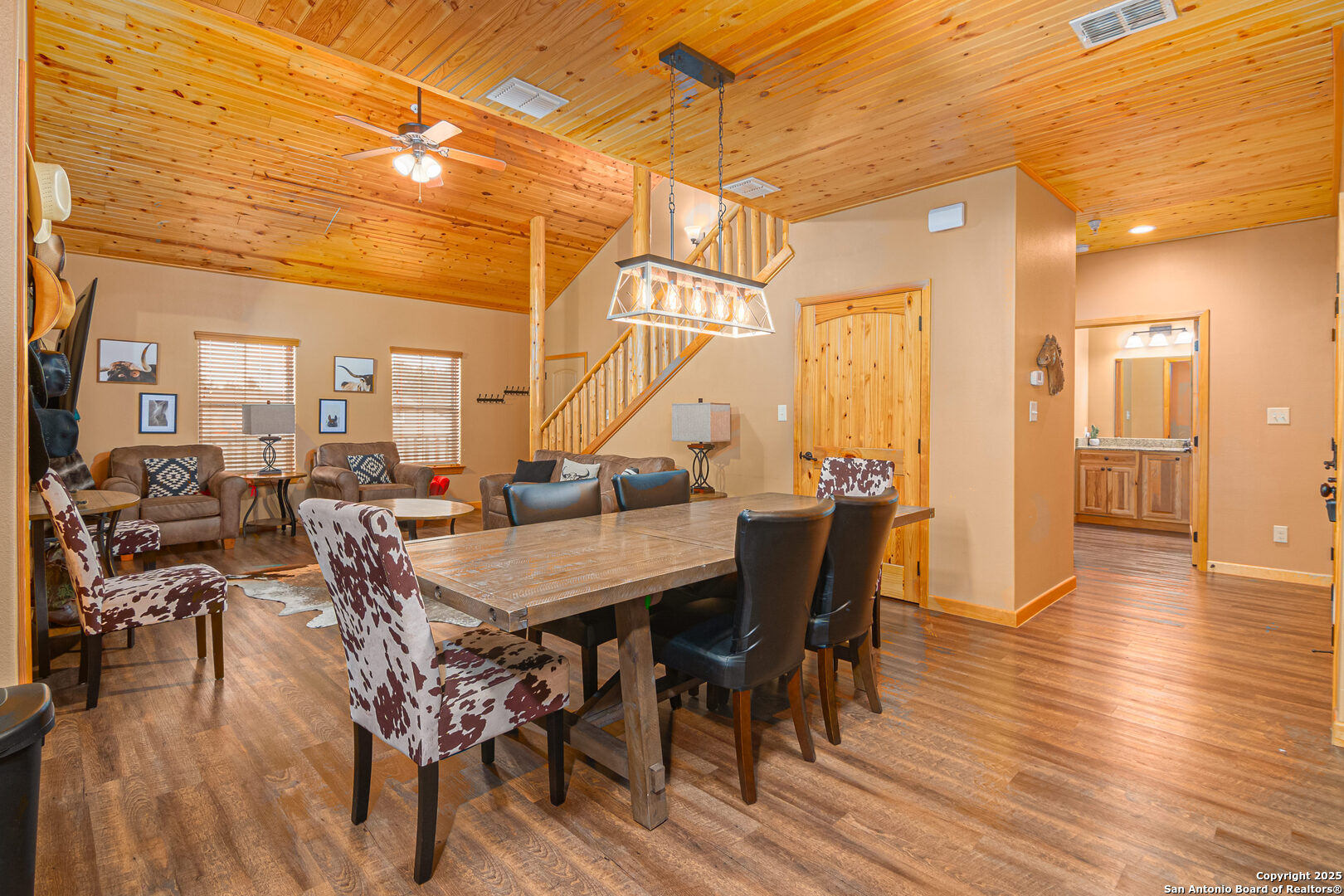 1554 Gruene Road, Unit A5 New Braunfels, TX 78130 - Photo 6 of 22 a view of a dining room with furniture and wooden floor