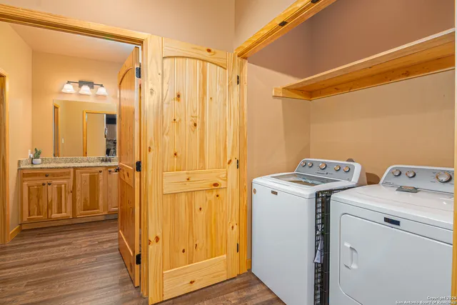 a view of a storage & utility room with a washer and dryer