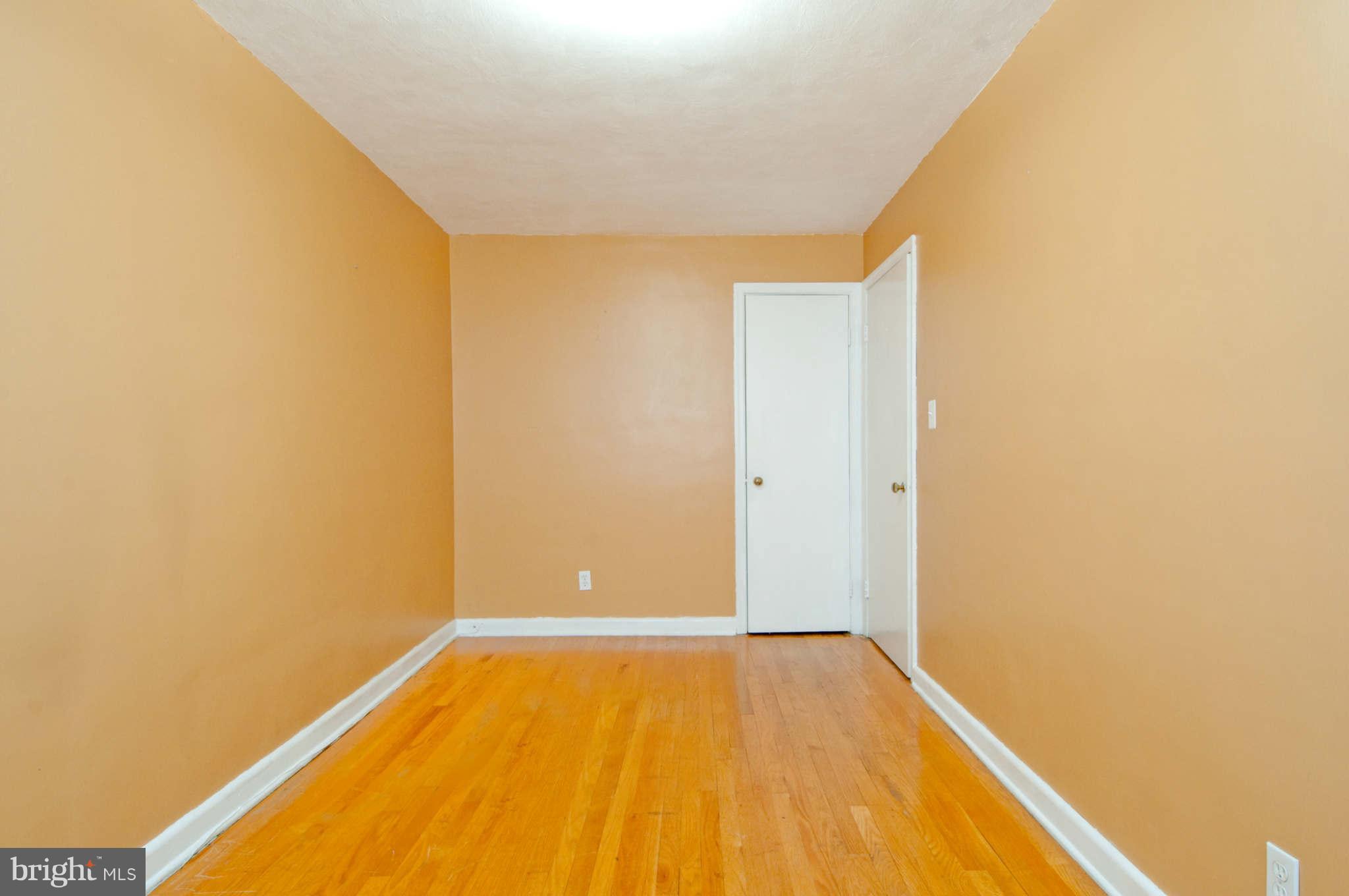 422 Westfield Road Baltimore, MD 21222 - Photo 15 of 24 a view of a room with wooden floor and a wall