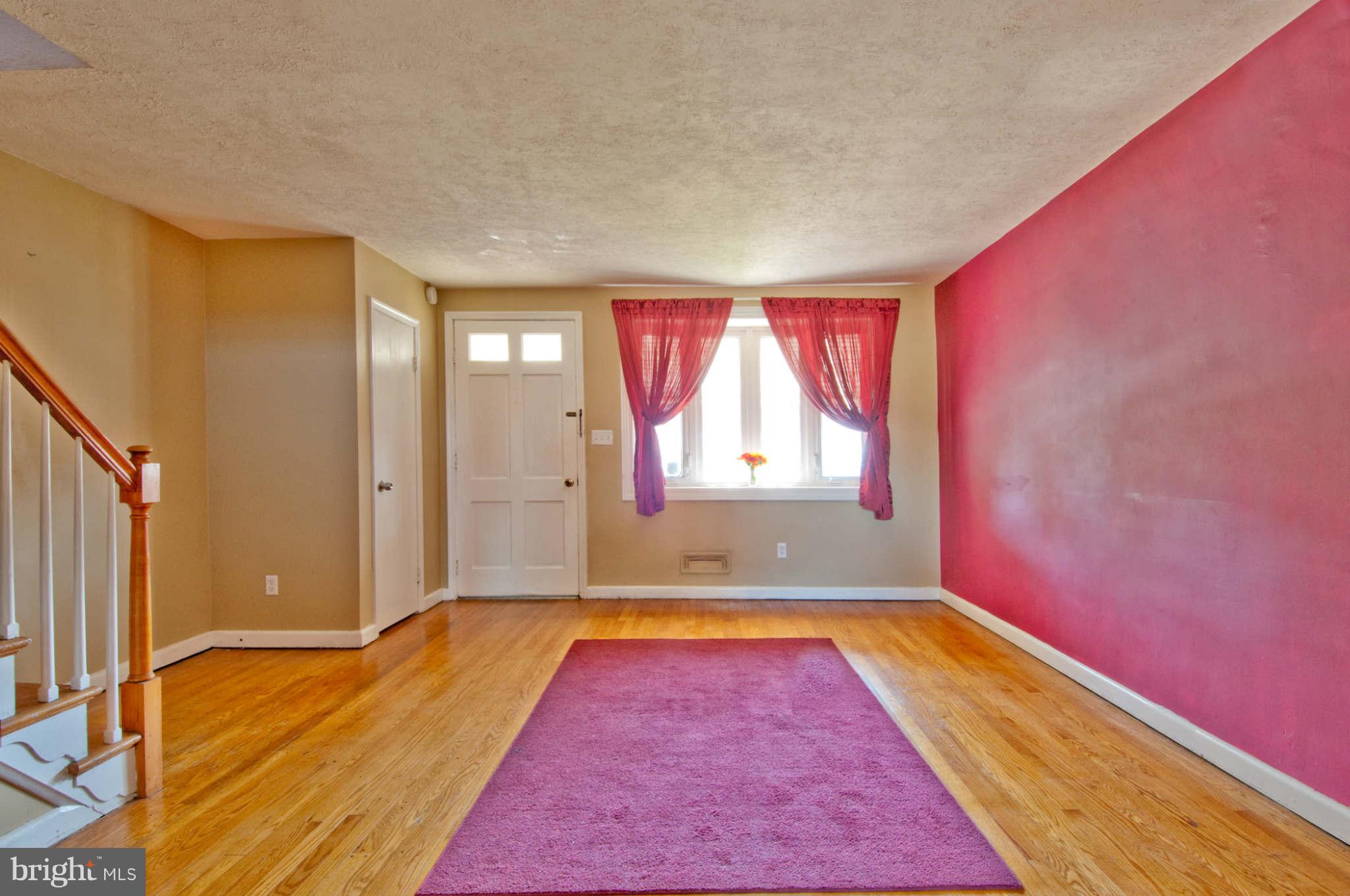 422 Westfield Road Baltimore, MD 21222 - Photo 3 of 24 a view of a livingroom with wooden floor and a bathroom
