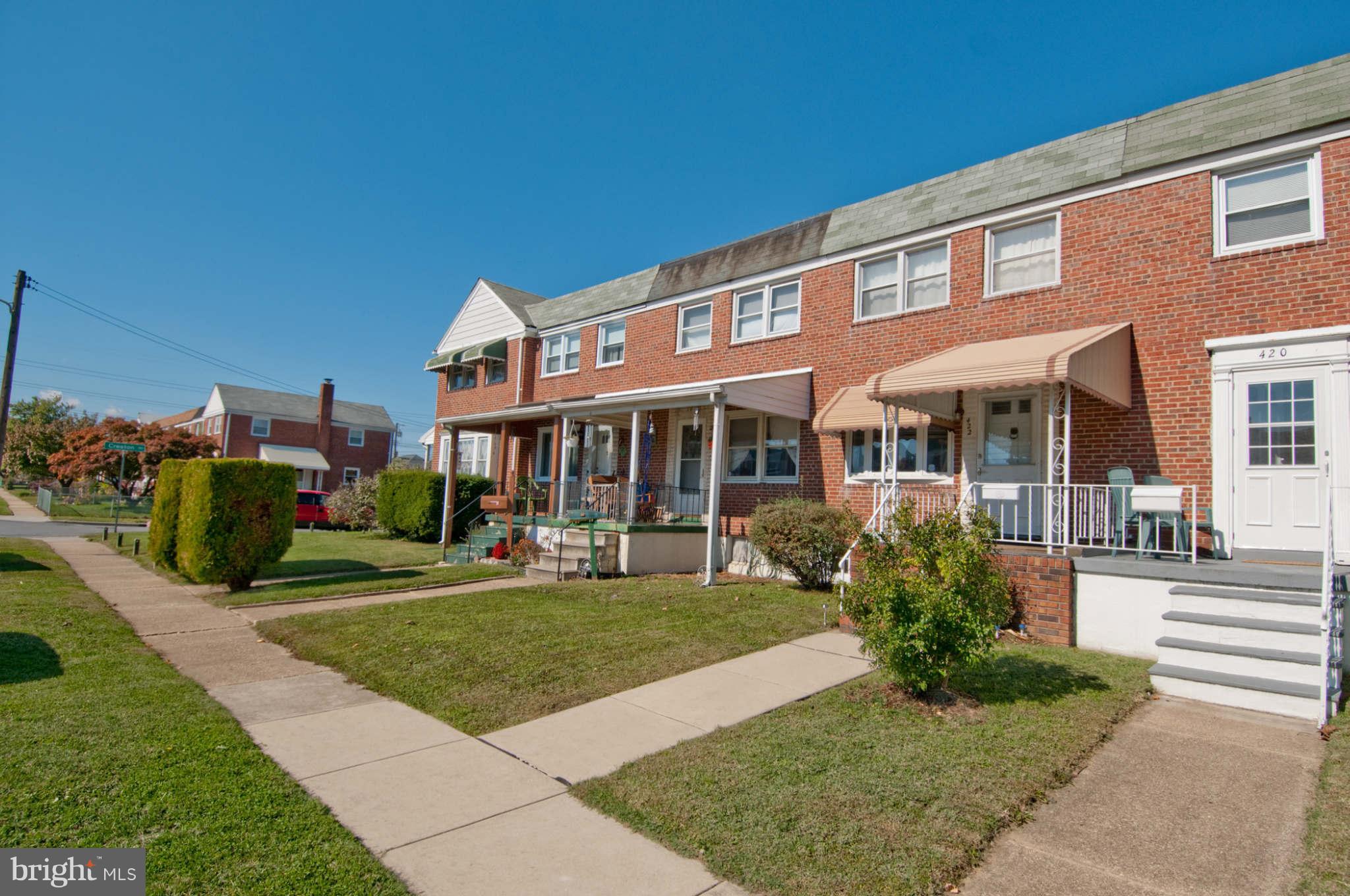 422 Westfield Road Baltimore, MD 21222 - Photo 22 of 24 a front view of a house with a yard