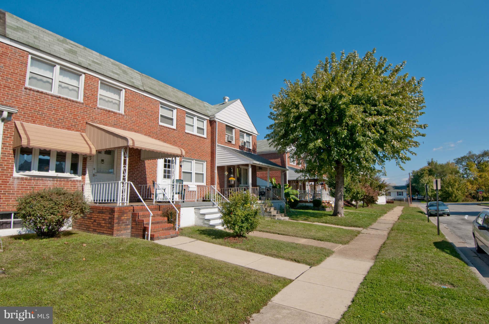 422 Westfield Road Baltimore, MD 21222 - Photo 23 of 24 a front view of a house with a yard