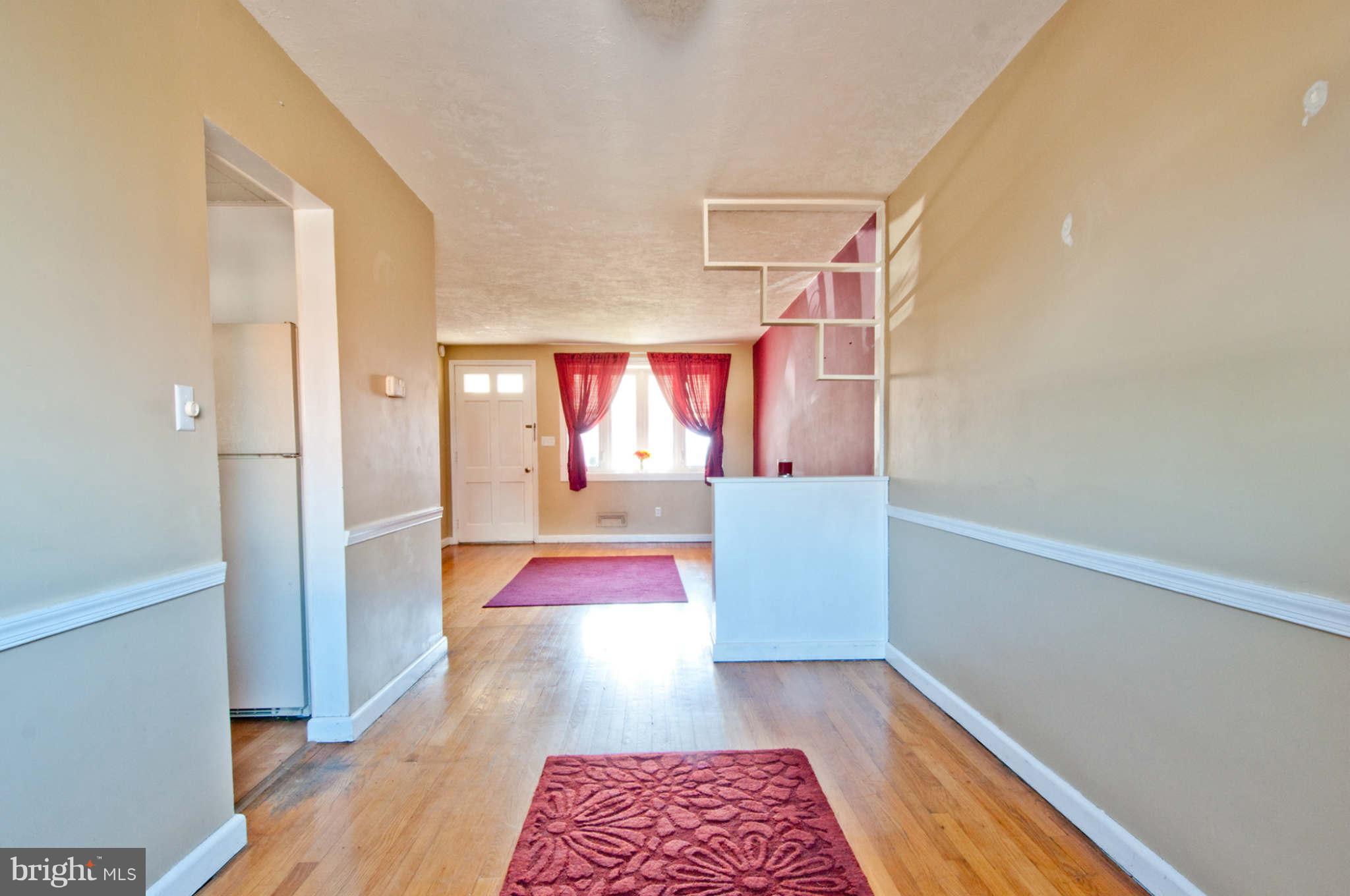 422 Westfield Road Baltimore, MD 21222 - Photo 5 of 24 a view of front door with wooden floor and furniture