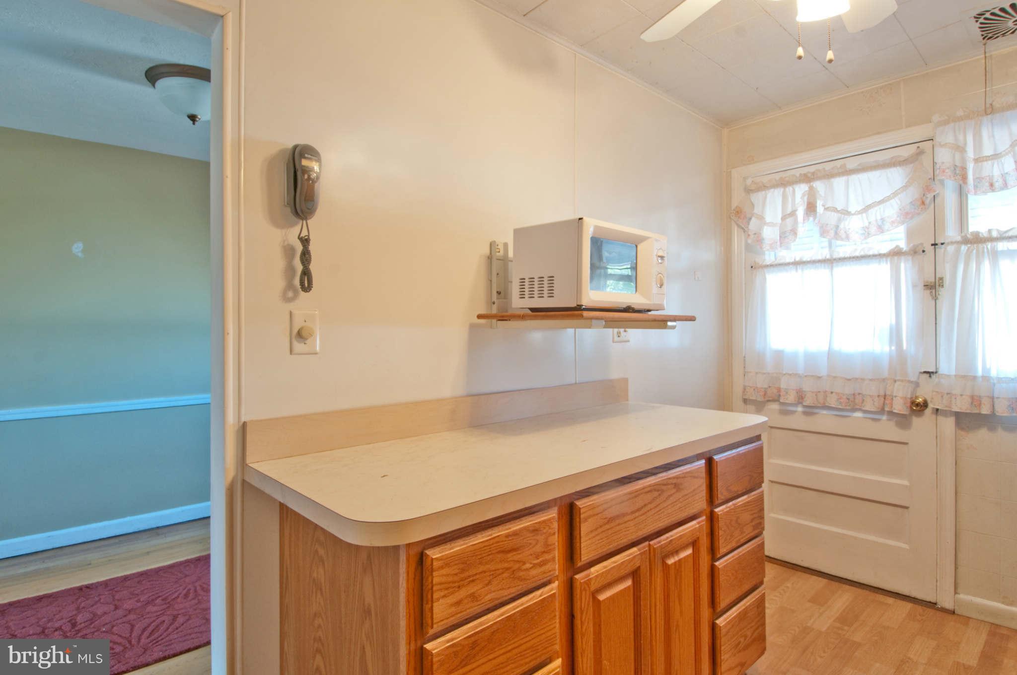 422 Westfield Road Baltimore, MD 21222 - Photo 7 of 24 a kitchen that has a sink and a stove
