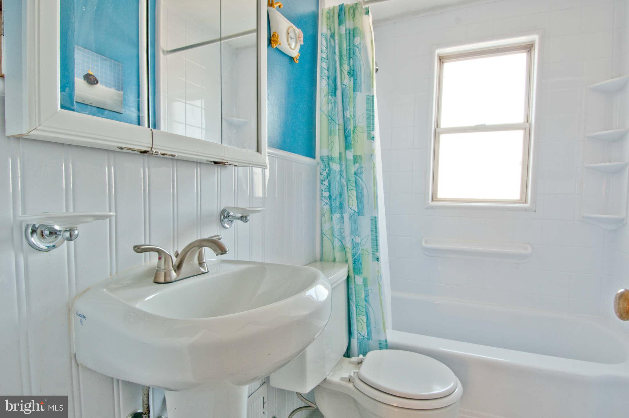 422 Westfield Road Baltimore, MD 21222 - Photo 10 of 24 a bathroom with a sink toilet and shower