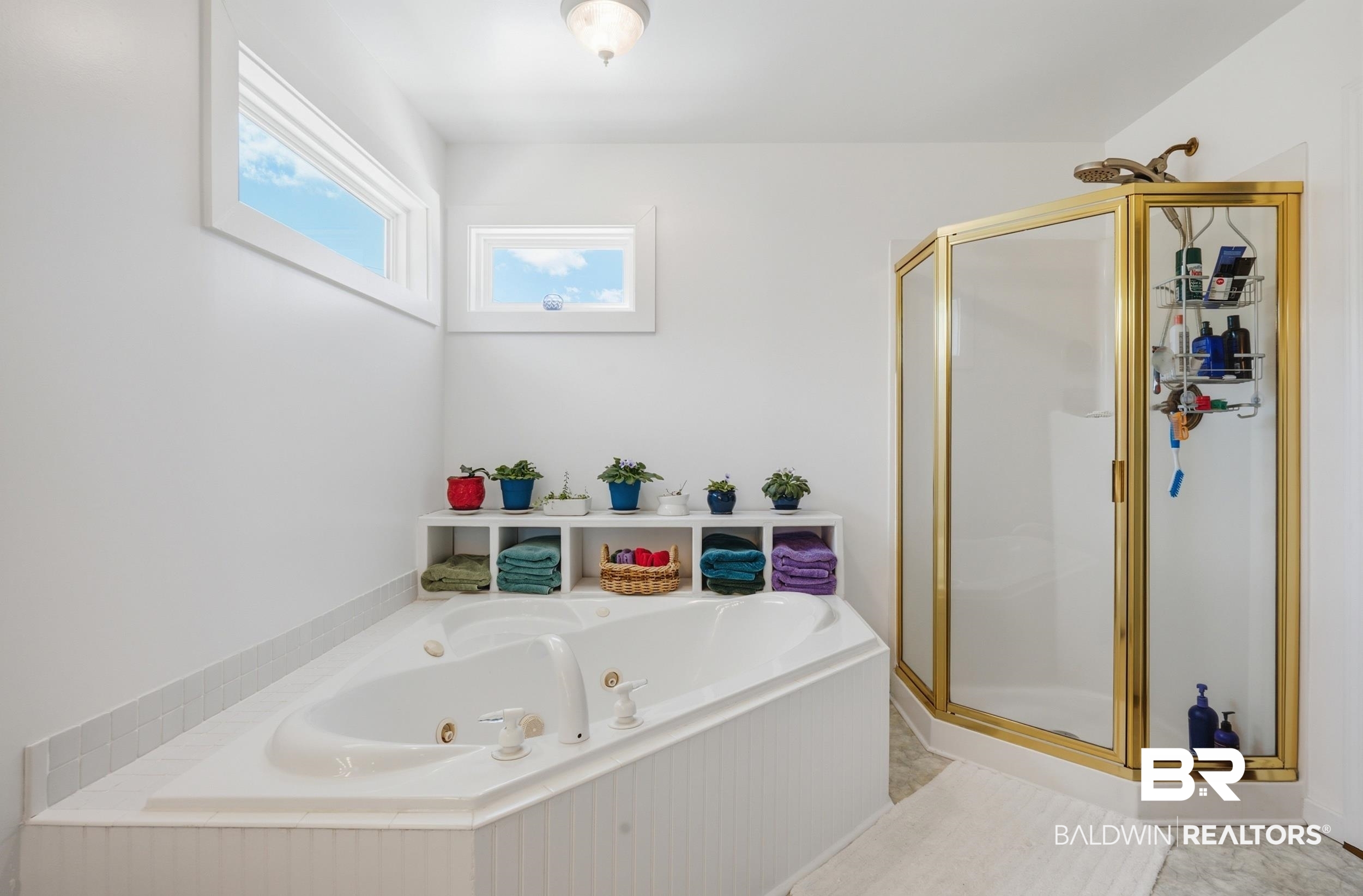 15855 Calvin Richerson Road Bay Minette, AL 36507 - Photo 60 of 83 Corner jetted tub with white tile surround and beadboard paneling