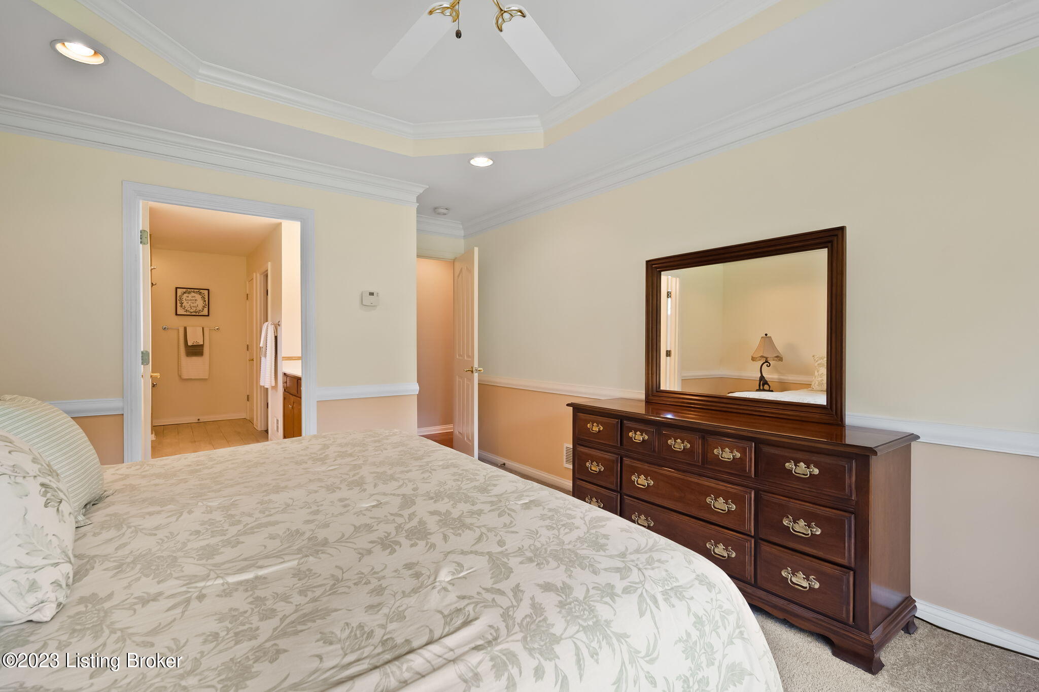4610 Stone Ridge Road Crestwood, KY 40014 - Photo 23 of 52 The primary suite features a tray ceiling with a fan, elegant crown molding & chair rail, newer carpet, and fresh paint