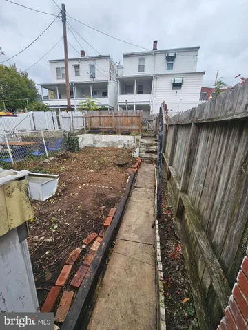 a view of an house with backyard space and garden
