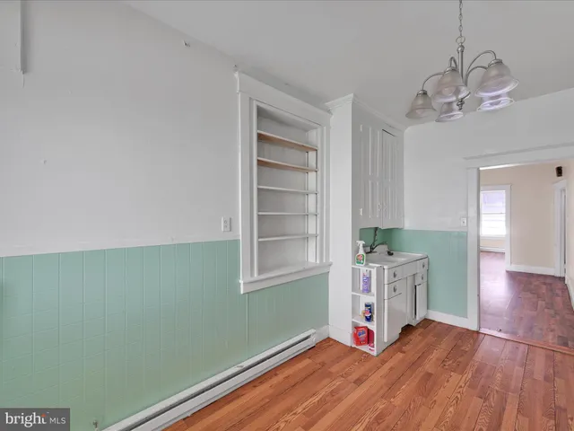 a room with stairs and wooden floor