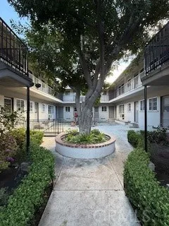 a front view of a house with garden and porch