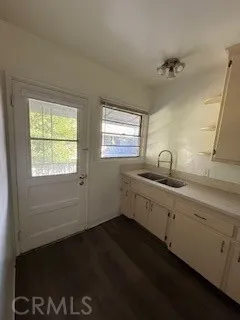 a kitchen with sink and window
